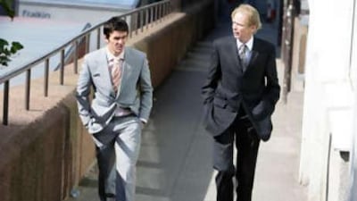 The troubled Newcastle United midfielder Joey Barton, left, walks to court.