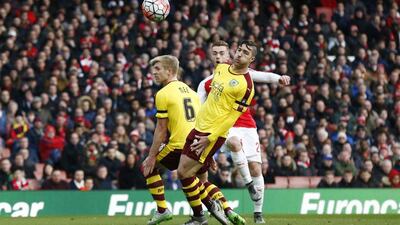 Calum Chambers scores the first goal for Arsenal against Burnley on Saturday in the FA Cup match at the Emirates Stadium. Eddie Keogh / Reuters