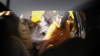 Chennai Super Kings team principal Gurunath Meiyappan getting into a car on June 4, 2013, after he was granted bail by a Mumbai court for spot fixing in cricket, in Mumbai, India. Rajanish Kakade / AP Photo