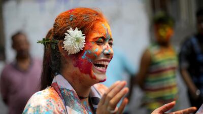 Tourists and locals apply colour dust to each other as they celebrate Holi festival in Kolkata, Eastern India. EPA