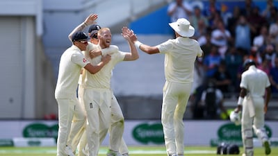 England all-rounder Ben Stokes celebrates with Sam Curran and Stuart Broad after dismissing Hardik Pandya. Getty Images