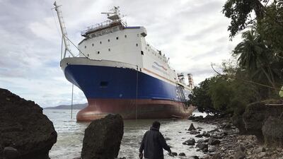 A cargo ship is seen near the shore in Mabini, south of Manila, on December 26, 2016, after being pushed there by Typhoon Nock-Ten. Bullit Marquez/Ap Photo