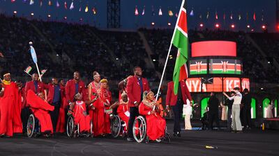Ferdinand Omanyala and Carolina Wanjira, flagbearers of Team Kenya, lead their team. Getty Images