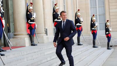 French President Emmanuel Macron leaves after delivering a joint statement on migration. Reuters