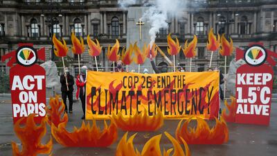 Activists symbolically set George Square on fire with an art installation of faux flames and smoke before the UN Climate Change Conference in Glasgow, Scotland. Reuters