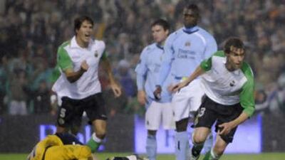 Racing Santander's Juan Valera, right, celebrates his goal against Manchester City.