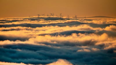 Wind turbines stand are surrounded by fog and clouds in the Taunus region near Frankfurt, Germany. AP Photo