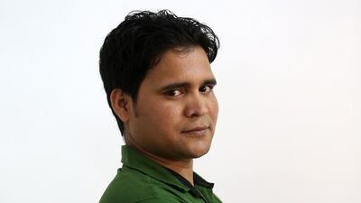 Amirul Hassan, a plumber from Bihar, India, has his portrait taken. Pawan Singh / The National