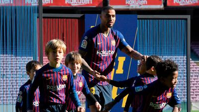 Barcelona's new Ghanaian forward Kevin-Prince Boateng, centre, poses with children during his official presentation at Camp Nou. AFP