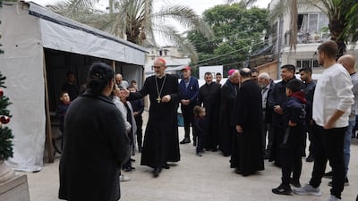 Cardinal Pierbattista Pizzaballa , Latin Patriarch of Jerusalem, greets people during a pastoral visit to the Holy Family parish in Gaza city. AFP