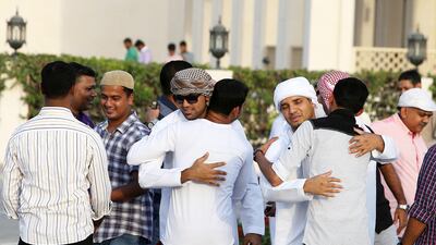 Worshippers at Zabeel Mosque in Dubai greeting each other on Eid Al Fitr. Pawan Singh / The National