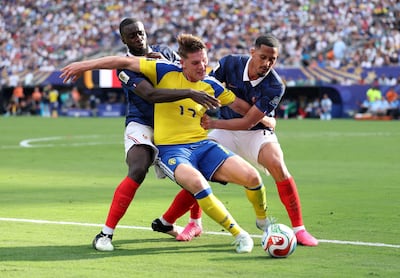 France defenders Dayot Upamecano and William Saliba put pressure on Sweden striker Viktor Gyokeres during Les Blues' Round-of-32 victory in New Jersey. AFP