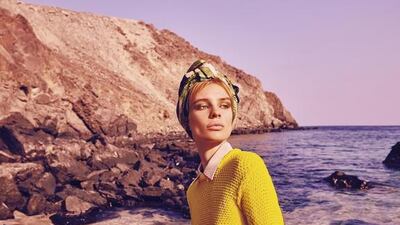 OLD SCHOOL: Shirt, Dh1,150, Max Mara; Sweater, Dh2,290, J.W. Anderson; Skirt, Dh1,490, Max & Co; Scarf, Dh1,720, Hermes; Bag, Dh12,010, Prada