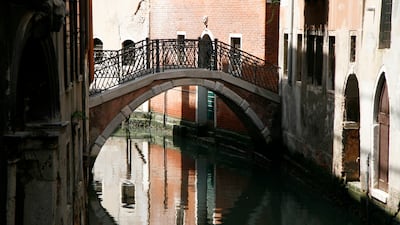 Small walkways and bridges are dotted about the Italian city. Photo: John Brunton