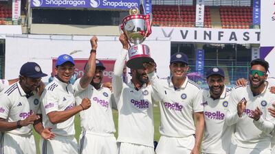 India players celebrate with the series trophy after wining the second Test against the West Indies at the Arun Jaitley Stadium in Delhi. AP