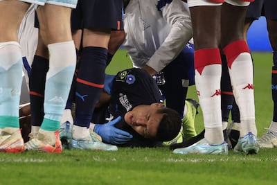Marseille's Moroccan midfielder Amine Harit reacts in pain after suffering an injury during the match against Monaco. AFP