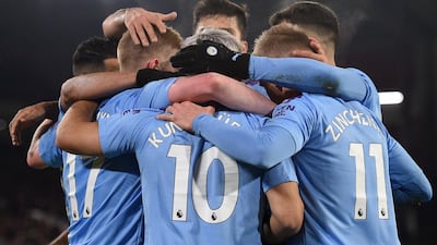 Sergio Aguero (C) and teammates celebrate scoring the winning goal. AFP