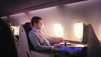 Business class sits between a large kitchen galley and a decent-sized bar/lounge area. Courtesy Qatar Airways