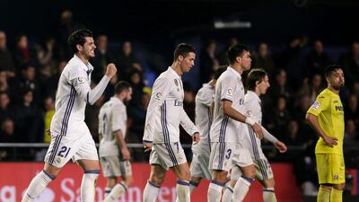 Real Madrid forward Alvaro Morata left, celebrates after scoring the winner against Villarreal. Biel Alino / AFP