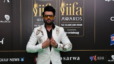 Manish Paul, in an embellished white blazer with a black shirt. AFP