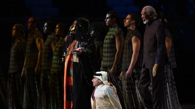 Al Muftah is joined by Qatari singer Dana Al Fardan and performers on stage. AFP