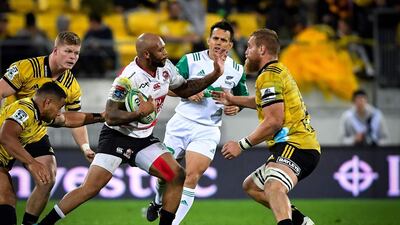 Brad Shields, right, in action for Wellington Hurricanes, is in the England squad but has been told he 'probably' would have been called up by New Zealand had he still been available. Mark Tantrum / AFP