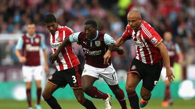Marvin Sordell of Burnley competes with Wes Brown, right, and Patrick Van Aanholt of Sunderland during their Premier League match on Saturday. Chris Brunskill / Getty Images