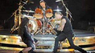 James Hetfield, right, Robert Trujillo, left, and Lars Ulrich, middle, of the US heavy metal band Metallica perform during a concert in Berlin.