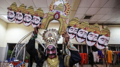 An Indian artist prepares backstage to play the role of Demon King Ravana, during the Ramlila or 'Lord Rama's Play,' a traditional performance of the Ramayana epic, on the occassion of Dussehra, in Mumbai, India. Divyakant Solanki / EPA