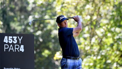 Ian Poulter of England hits his tee shot on the fourth hole. AFP