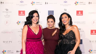Huda and Mona Kattan with Eva Longoria at the Global Gift Gala red carpet in Dubai. Reem Mohammed / The National