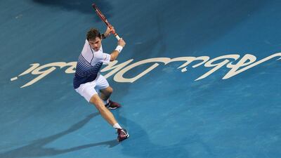 Stan Wawrinka plays a shot during his opening match on Thursday night at the Mubadala World Tennis Championship in Abu Dhabi. Wawrinka defeated Nicolas Almagro. Kamran Jebreili / AP