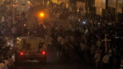 Egyptian Christians clash with soldiers and riot police during a protest against an attack on a church in southern Egypt, in Cairo October 9, 2011. Nineteen people were killed in Cairo on Sunday when Christians, some carrying crosses and pictures of Jesus???
