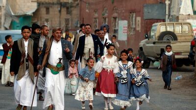 People arrive for Eid al-Fitr prayers outside a mosque in Sana'a, Yemen. EPA