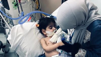 Shaima Swileh holds her dying son Abdullah at a hospital in Oakland, California. AP