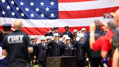 Firefighters outside Engine 54/Ladder 4/Battalion 9 firehouse. AFP