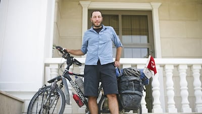 Genc has travelled across 40 countries on his bicycle, being welcomed kindly by strangers, harassed by soldiers and helped by children along the way. He gives much of the proceeds from adverts on his blog site to Turkish charities. Lee Hoagland / The National; Courtesy Gurkan Genc