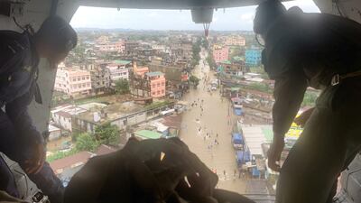 Indian troops drop relief supplies from a plane in Silchar, a town in Assam state affected by floods. Photo: Indian Air Force