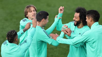 James Rodriguez, Marcelo and Luka Modric share a joke during their training session. Getty