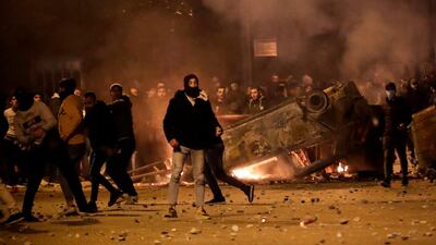 Supporters of Lebanon's Hezbollah and Amal groups clash with security forces late on December 17, 2019 in central Beirut. AFP