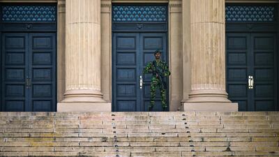 A Sri Lankan soldier stands guard outside the Presidential Secretariat before the swearing-in ceremony of President-elect Anura Kumara Dissanayake in Colombo. AFP