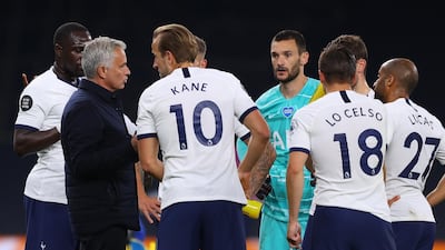 Tottenham manager Jose Mourinho talks to his players during a drinks break. EPA