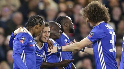 N'Golo Kante, centre, celebrates with teammates after scoring the only goal of the game in Chelsea's 1-0 FA Cup quarter-final victory against Manchester United. Alastair Grant / AP Photo