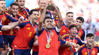 Rodri lifts the World Cup trophy following Spain's victory over Argentina in the 2026 final. AFP