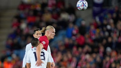 Erling Haaland competes for a header during Norway's match against Serbia. EPA
