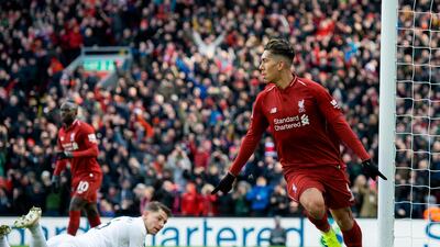 Liverpool's Roberto Firmino, left, celebrates putting Liverpool 2-1 ahead against Burnley. EPA