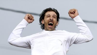 Fabian Cancellara (SUI) of Switzerland celebrates on the podium. REUTERS/Matthew Childs