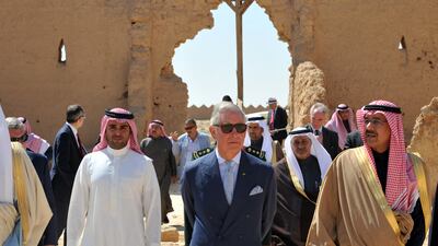 Britain's Prince Charles (C) visits an historical site under reconstruction at the old city of al-Diriyah, on the northwestern outskirts of Riyadh, Saudi Arabia, 19 February 2014. EPA
