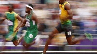 The gold won by Usain Bolt, right, in the men's 200-meter is representative of 1.4 million Jamaicans.