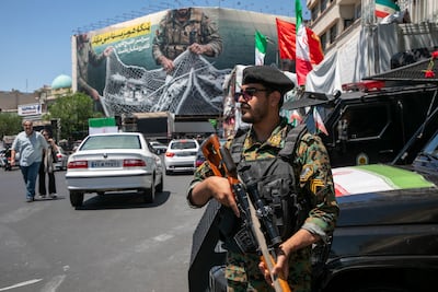 A police officer stands guard in a main square of Tehran. Getty Images